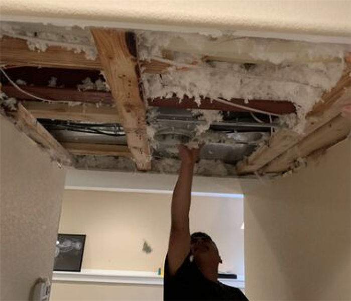 Storm causes leak in the ceiling of a home