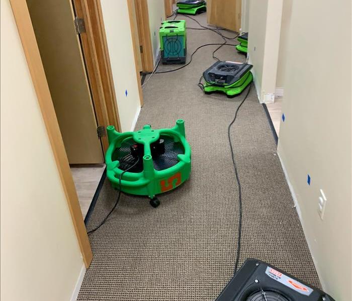 Drying the water damage in a hotel room