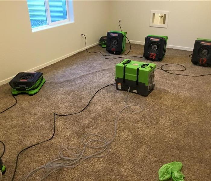 Drying equipment set up in the bedroom of a house