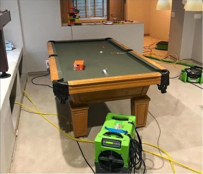 SERVPRO dehumidifier on carpet in front of pool table