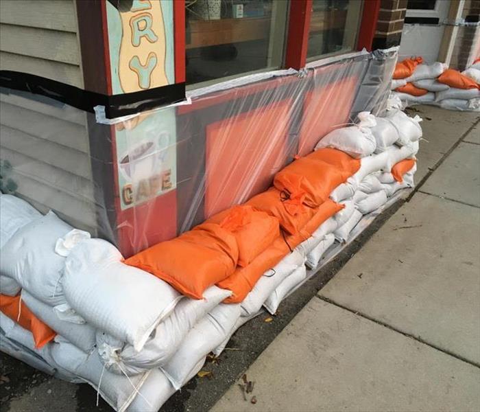 Sandbags setup in front of a business